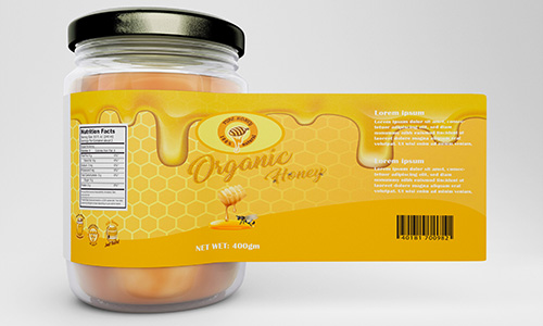 A rectangle label being used as a food label for honey on a mason jar.